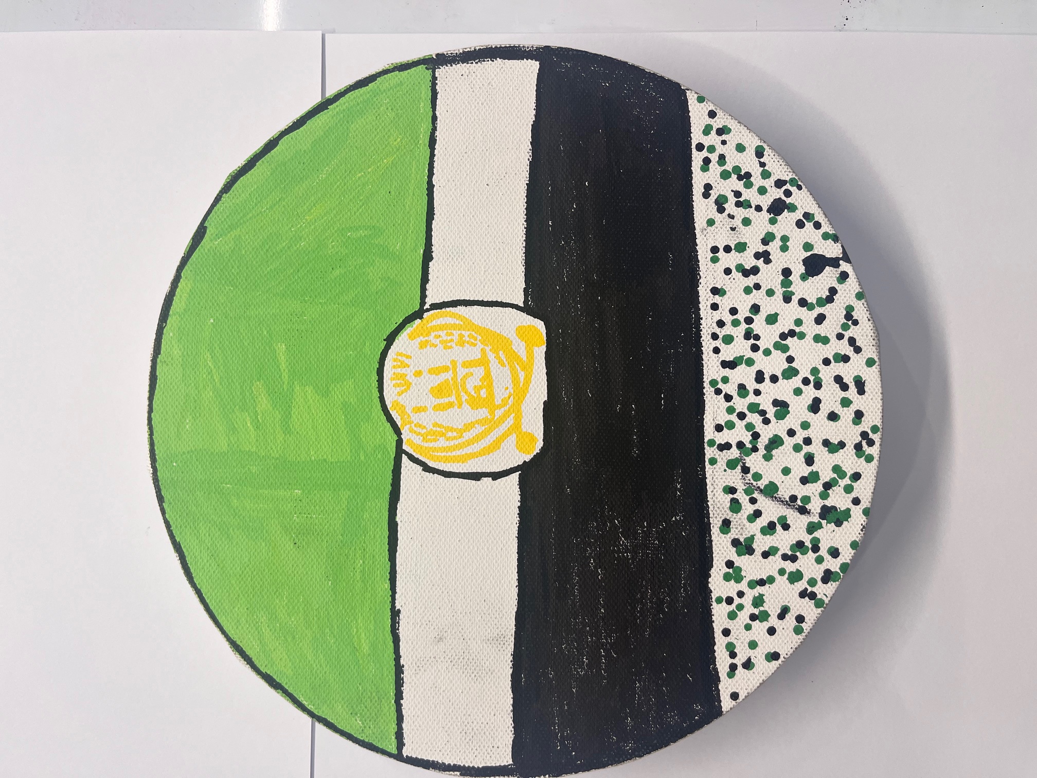 Round canvas painted with Afghan flag bands of green, white and black, with a dotted lower register